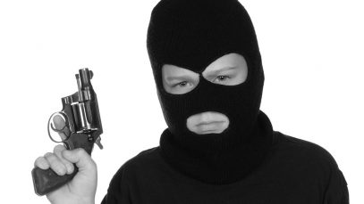 A young boy shows how he is entering a lifestyle of crime and gangs. Image shot 2008. Exact date unknown.